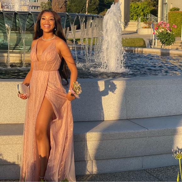 This dress is prom David’s Bridal, light/baby pink, and size 4